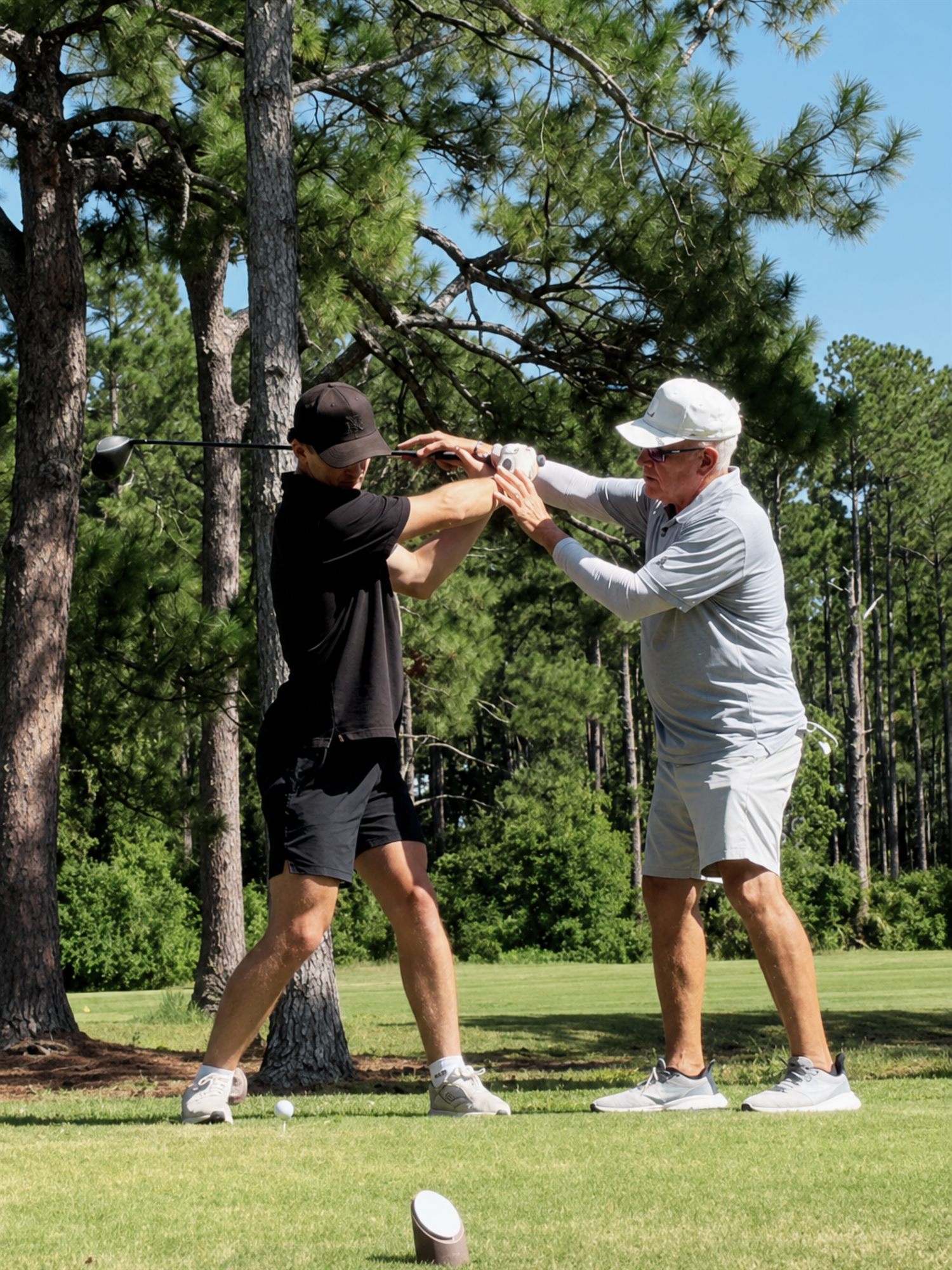Rex Blair teaching a lesson out on the course